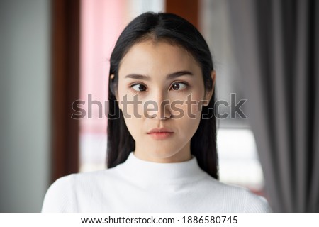 woman suffering from strabismus, eye sickness or disorder, eye care, accessibility or a11y concept Royalty-Free Stock Photo #1886580745