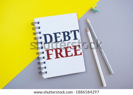 Debt Free text with notepad. Conceptual photo Credit Money Financial Sign Freedom From Loan Mortage .Business photo showcasing free from owning any money to any individual or a company