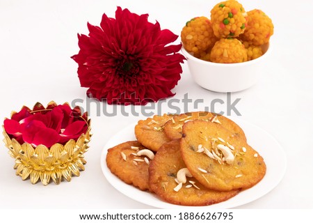 Traditional Indian Mawa Malpua Is Most Loved And Famous Mithai Served On Festivals In Bihari Bengali Rajasthani Culture In India Bangladesh And Nepal. Floral Decoration Isolated On White Background