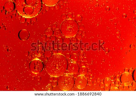Blue and red bubbles. Abstract background. Bubble oil on water. Macro-photography.