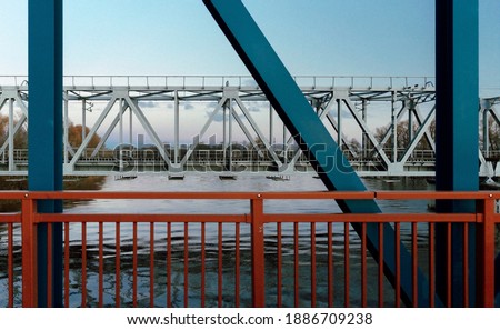 Structural elements of a railway bridge across the river. Two bridges are close by. Latvia