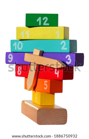 Wooden toy clocks, isolated against white background