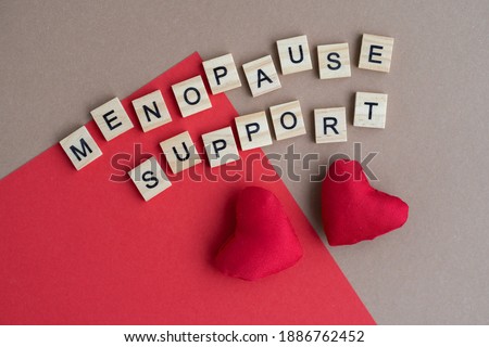 Concept. The inscription from the letters menopause. Symptoms of Menopause Harmonious changes in women older than 40 years. Royalty-Free Stock Photo #1886762452