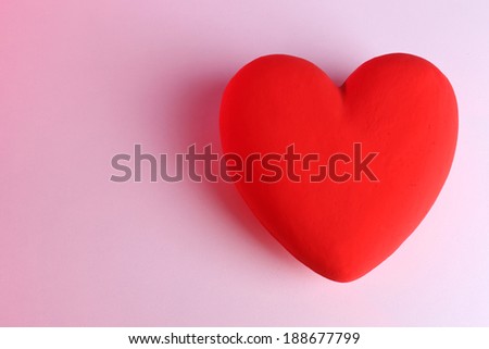 Decorative red heart, on color background