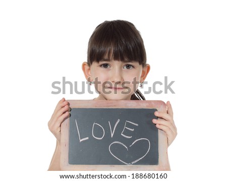 Young caucasian girl holding chalkboard signed love isolated on white