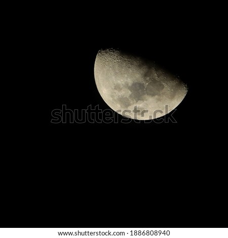 Half moon on black sky background at night 