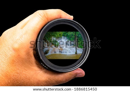 Hand holding lens Natural attractions Sea view Go for a photo tour