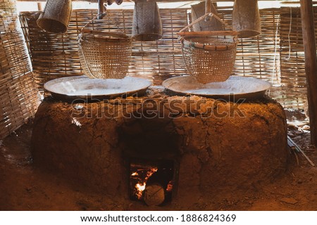 picture of production of natural rock salt by boiling saline from Sinthao salt pond in small village of Nan, Thailand