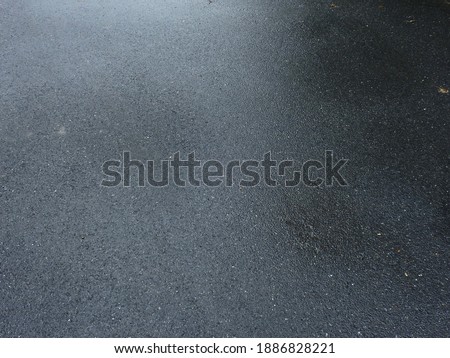 wet asphalt road after rain  Royalty-Free Stock Photo #1886828221