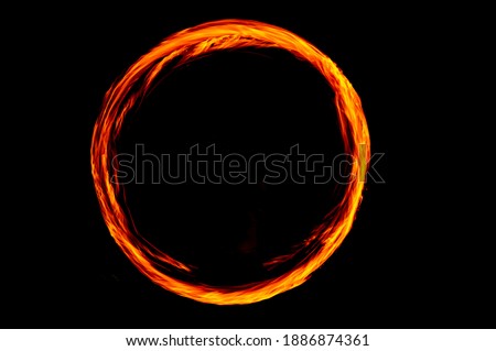 Circle of Fire flame with movment isolated on black isolated background - Beautiful yellow, orange and red and red blaze fire flame texture style. Royalty-Free Stock Photo #1886874361