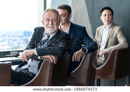businessman drink coffee and talk business deal at skyscraper office lounge with cityscape business zone background 