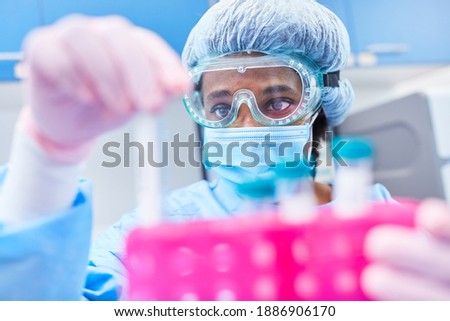 Doctors examine Covid-19 samples in the laboratory for mutations and gene sequences Royalty-Free Stock Photo #1886906170