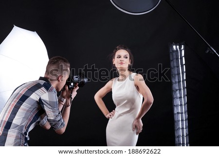 Movie star having a photosession with a famous photographer Royalty-Free Stock Photo #188692622