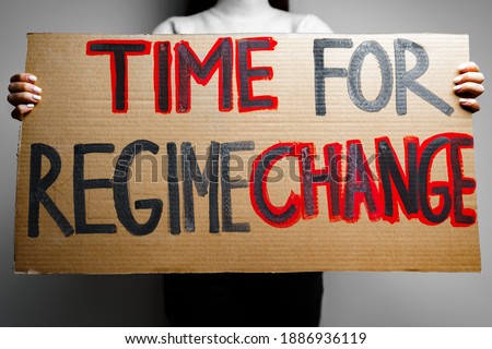 'Time for regime change' protest placard close up Royalty-Free Stock Photo #1886936119