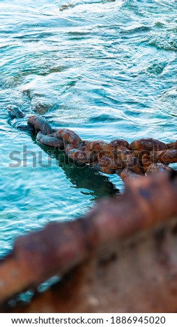 Old rusty boat chain and anchor
