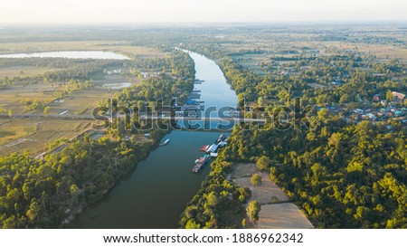 Scenic aerial view of the river bridge in rural Thailand