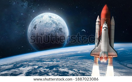 Space shuttle launch in the open space over the Earth. Ocean and sky under space ship. Planets in deep space. Elements of this image furnished by NASA