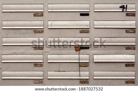 Mailboxes of an old apartment building.