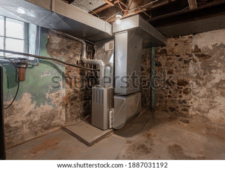 older home has furnace system repaired for the winter Royalty-Free Stock Photo #1887031192