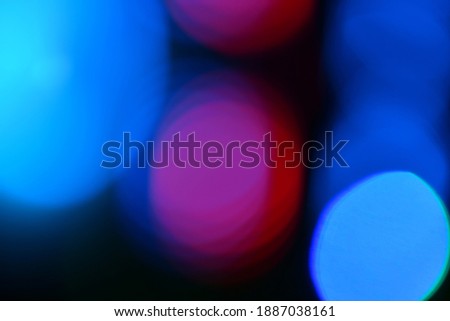 Multi-colored gradient circles on a dark background. Abstract blurred background.