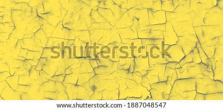 Textured metal background with cracks, tinted in the main color of 2021