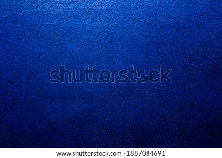Blue colored abstract wall background with textures of different shades of blues