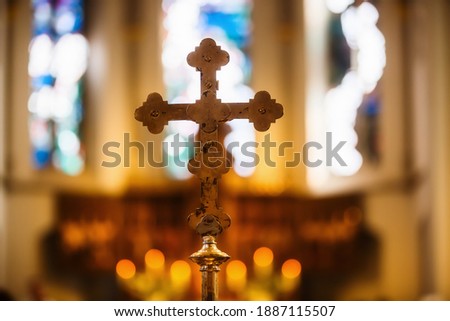 picture of a cross in front of the altar in a church