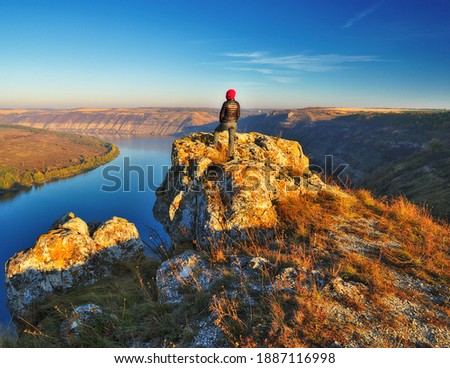 Young woman enjoying the beauty of nature in a picturesque canyon