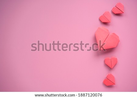 Valentine’s Day concept, Red heart on pink background.