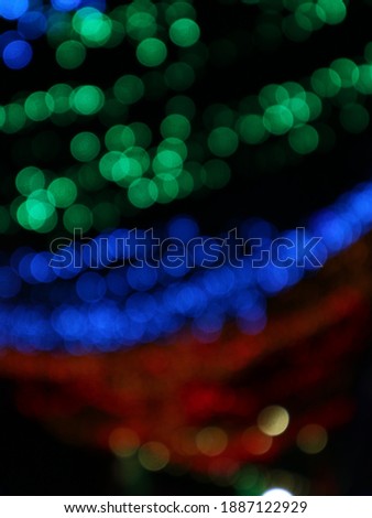 Blurry Colorful lamps that glow in the dark. Bokeh lamps. Party lights, defocused  