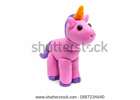 Play dough unicorn on white background. Handmade clay plasticine