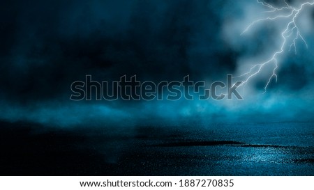 Dramatic background of the night sky, thunderstorm, lightning. Smoke, fog, smog against the background of the city landscape. Natural night landscape, night sky, wet asphalt, puddles.