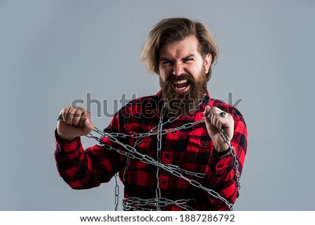 Suffering man chained feel cramps and muscle spasms, almost free. Royalty-Free Stock Photo #1887286792