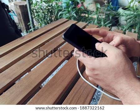 businessman hand finger touch on screen smartphone device for online trading network technology internet; mobile application