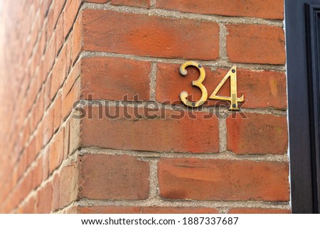 34 in golden metal digits