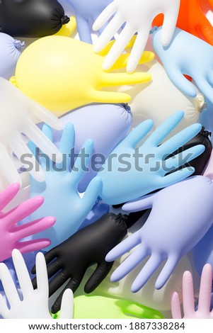 Set of multicolored rubber medical gloves background.