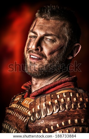 Portrait of a courageous ancient warrior in armor.