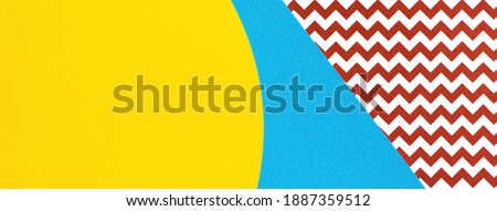 Abstract geometric fashion papers texture background in yellow,red, light blue colors. Top view, flat lay