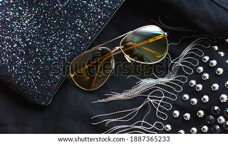 Stylish fashionable 80s glasses and clothes. Casual style in everyday life
