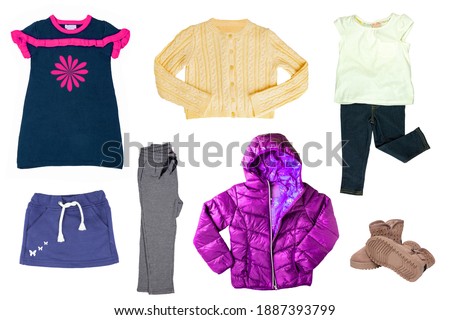 Collage set of little girl autumn clothing isolated on a white background. The collection of a down jacket, a sweater, a skirt, a dress and sweat pants, shirt with jeans and shoes. Kids winter fashion