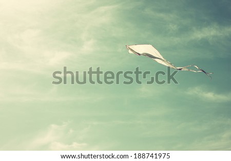 flying kite in the sky. retro filter design.