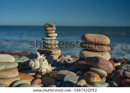 pyramid of stones with sea view