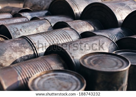 old metal cans lying on the ground