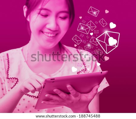 Happy woman sending email. Love concepts.