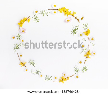 Spring frame of small flowers and daisy, floral arrangement
