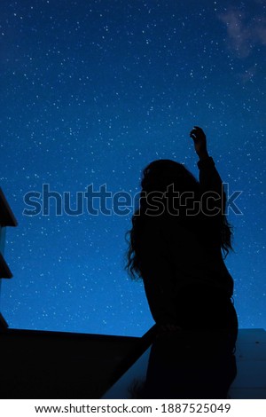 Starry sky. Girl’s shadow. Reflection