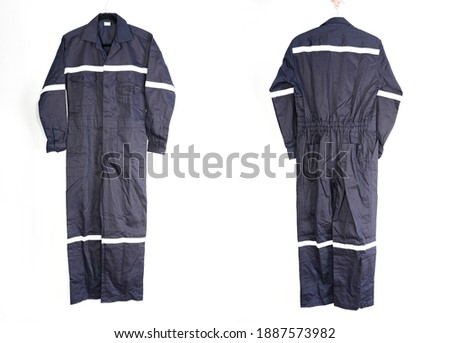 Navy-colored Coveralls with white reflective be appropriate for mechanics work or firefighter , thick fabrics, fire protection equipment and protect form equipment. Royalty-Free Stock Photo #1887573982
