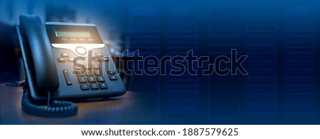 IP telephone device on blurred data center background with copy space, web banner or header design Royalty-Free Stock Photo #1887579625
