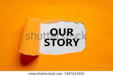 Our story symbol. Words 'Our story' appearing behind torn orange paper. Business and our story concept. Copy space. Royalty-Free Stock Photo #1887621850