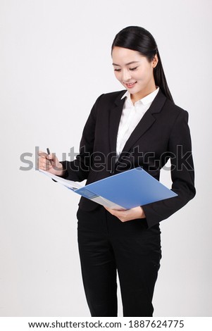 A business woman holding a blue folder high quality photo
